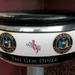 A close up of the side of a diner seat